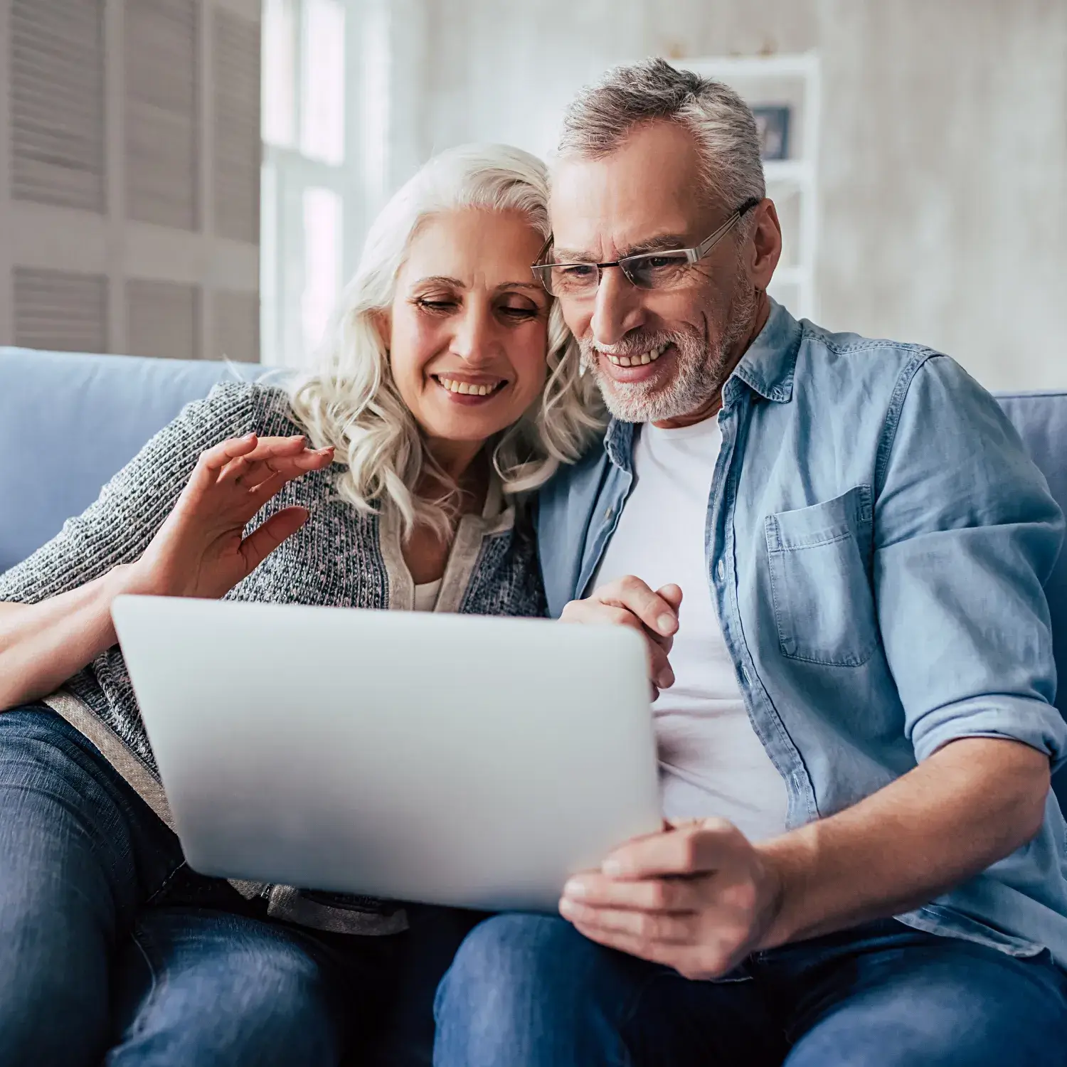 Old Couple watching something on their tab