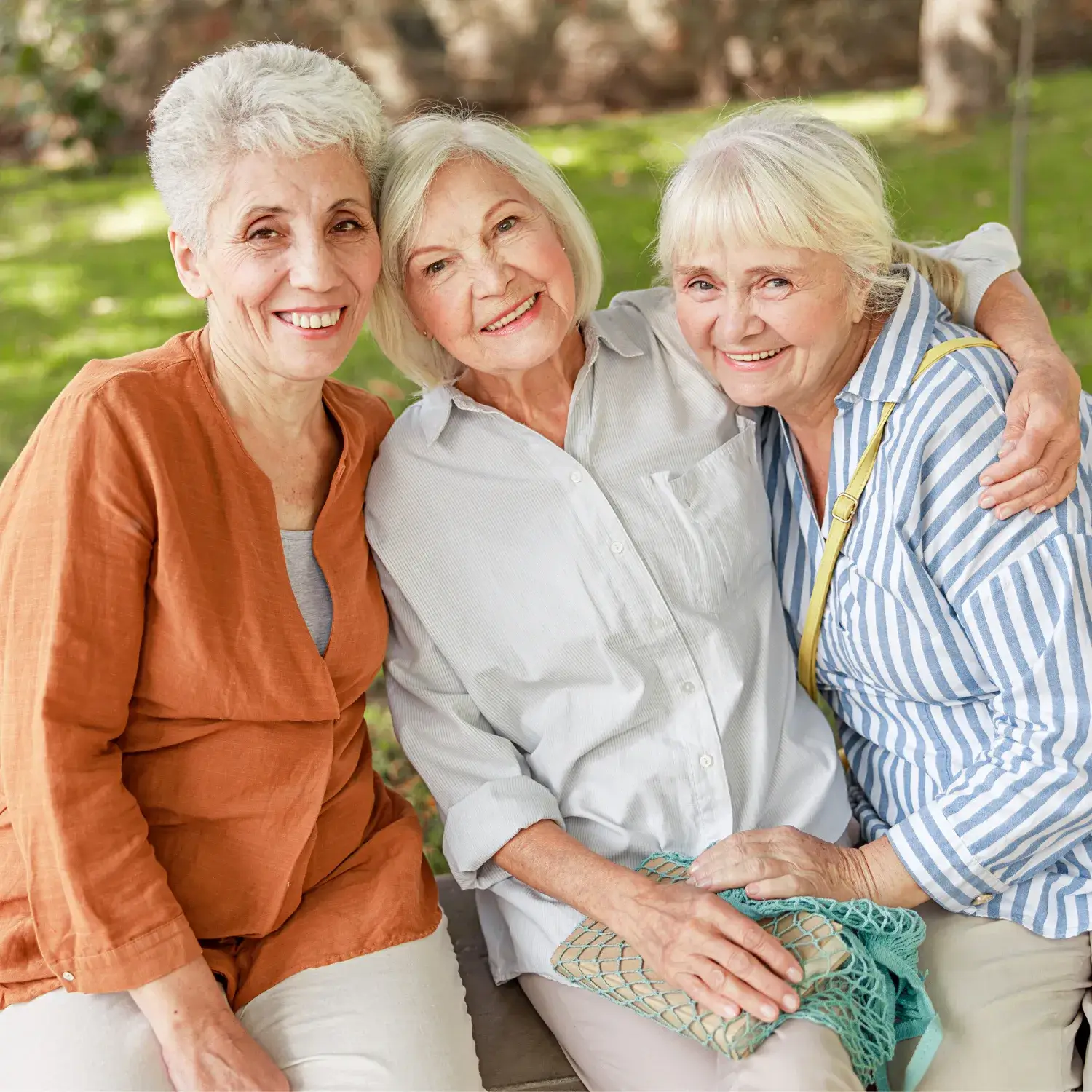 Three Old Woman Hugging Each Other